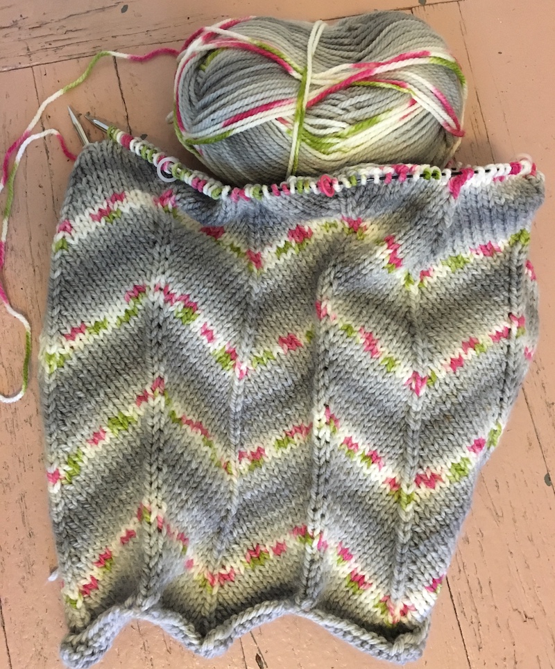 grey, pink, white, green knit baby blanket